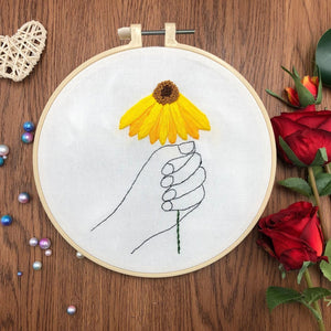 "The hand that holds the flower" - embroidery ktclubs.com